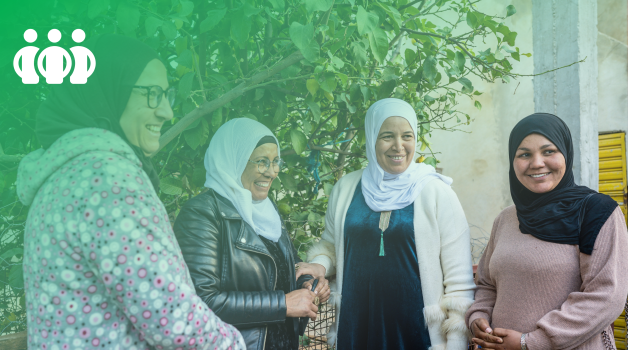 Outcome 3: Improving women's voice and agency. A group of four women having a conversation. 
