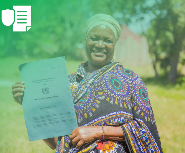 Outcome 4: Strengthen gender-response legal frameworks, policies and institutions. A woman holding a certificate.